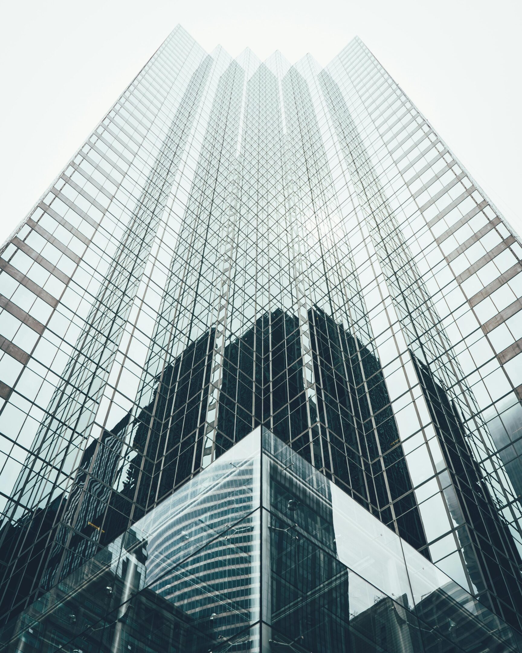 Glass Building A tall building with many windows in the middle of it